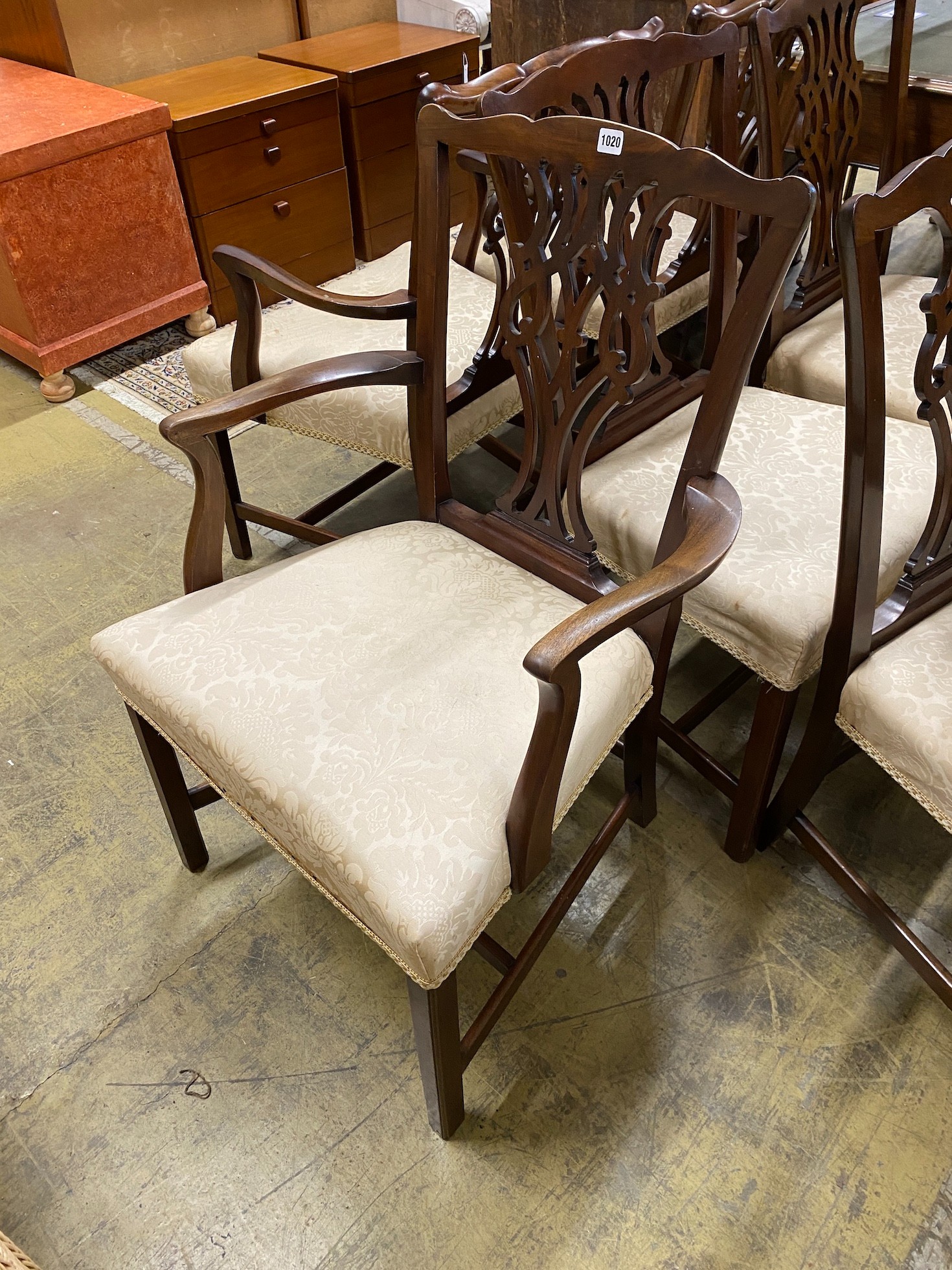 A set of ten Chippendale style mahogany dining chairs including two carvers, width 64cm, height 96cm